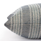 an indigo blue, aqua and white stripe outdoor pillow : close up side view