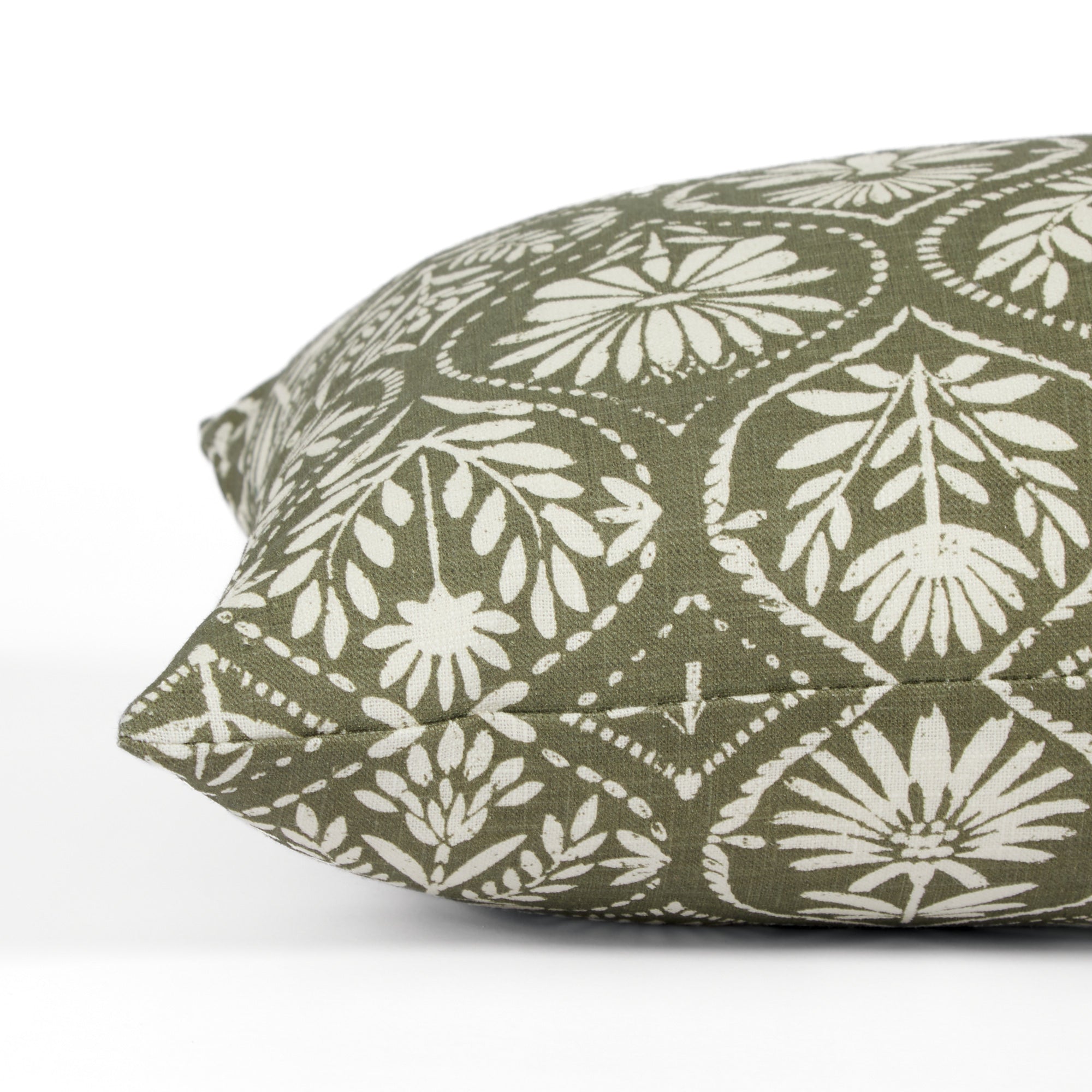 Side view of Tonic Living Stella Evergreen bed bolster highlighting its floral block print medallion pattern.
