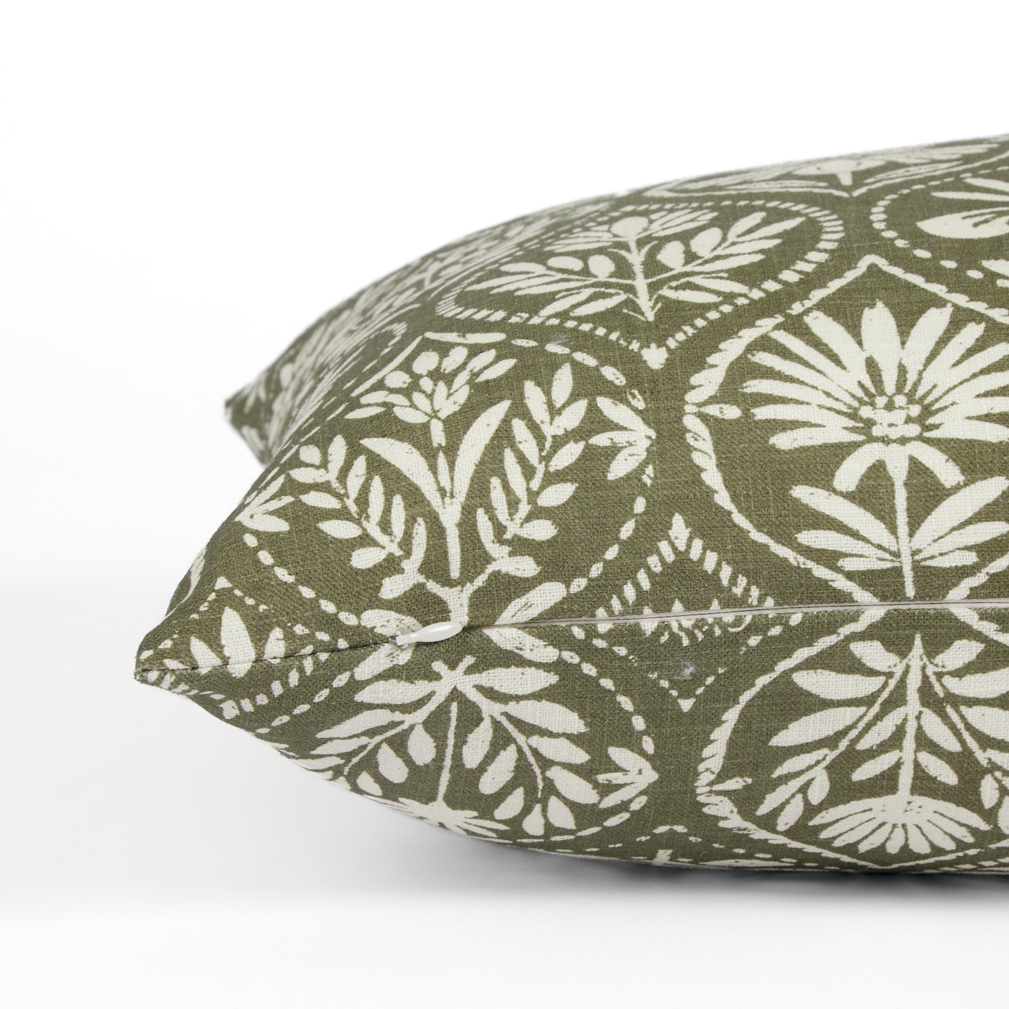 Side zipper detail of Tonic Living Stella 16x42 bolster pillow in dark olive green and natural floral print.