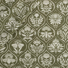 Tonic Living Stella Fabric in Evergreen, a dark olive green and beige drapery fabric with block print medallion pattern.