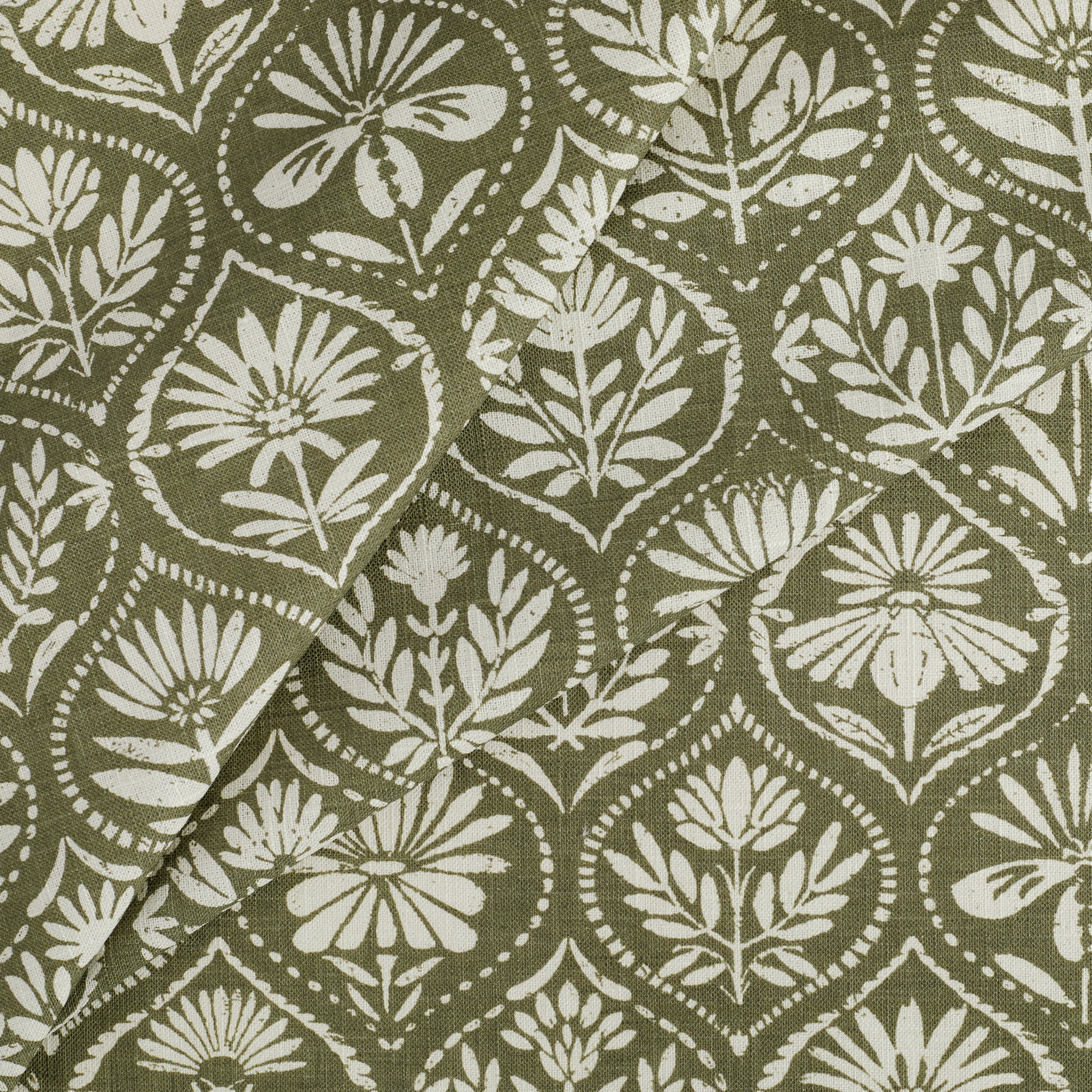 Tonic Living Stella Evergreen fabric featuring a dark olive green and natural block print style pattern for curtains.