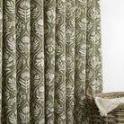 Tonic Living Stella Evergreen curtain fabric shown as drapery in olive green and natural block print design.