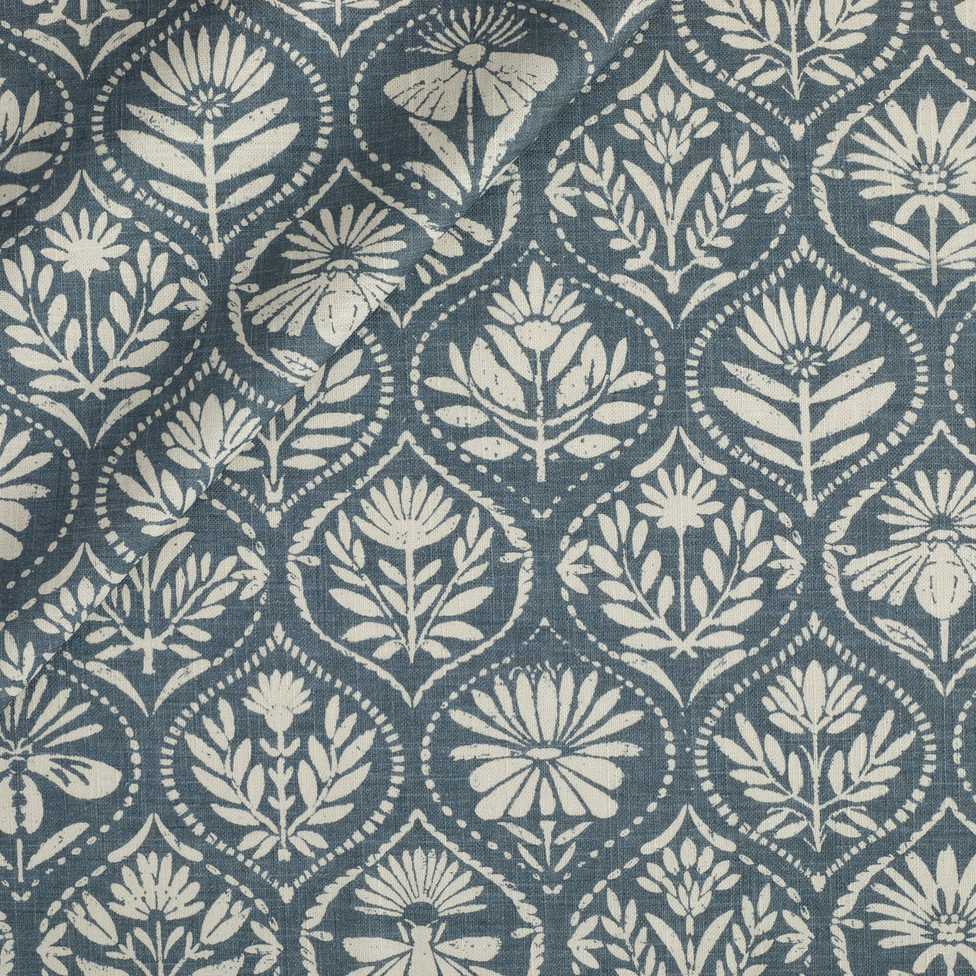 Tonic Living Stella Fabric in Harbour Blue, a blue and natural drapery fabric with block print medallion pattern.