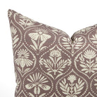 Close up of Tonic Living Stella Mauve cushion showing earthy mauve, beige, and natural floral medallion detail.