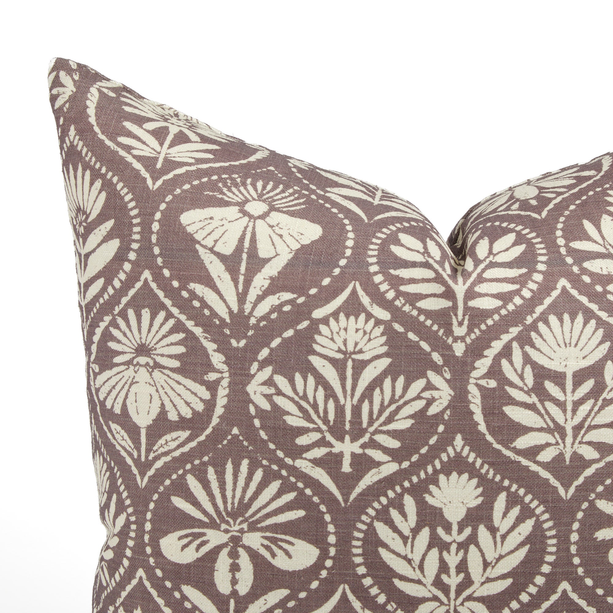 Close up of Tonic Living Stella Mauve cushion showing earthy mauve, beige, and natural floral medallion detail.