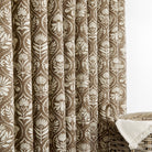 Tonic Living Stella Mocha curtain fabric shown as drapery in brown and beige block print design.