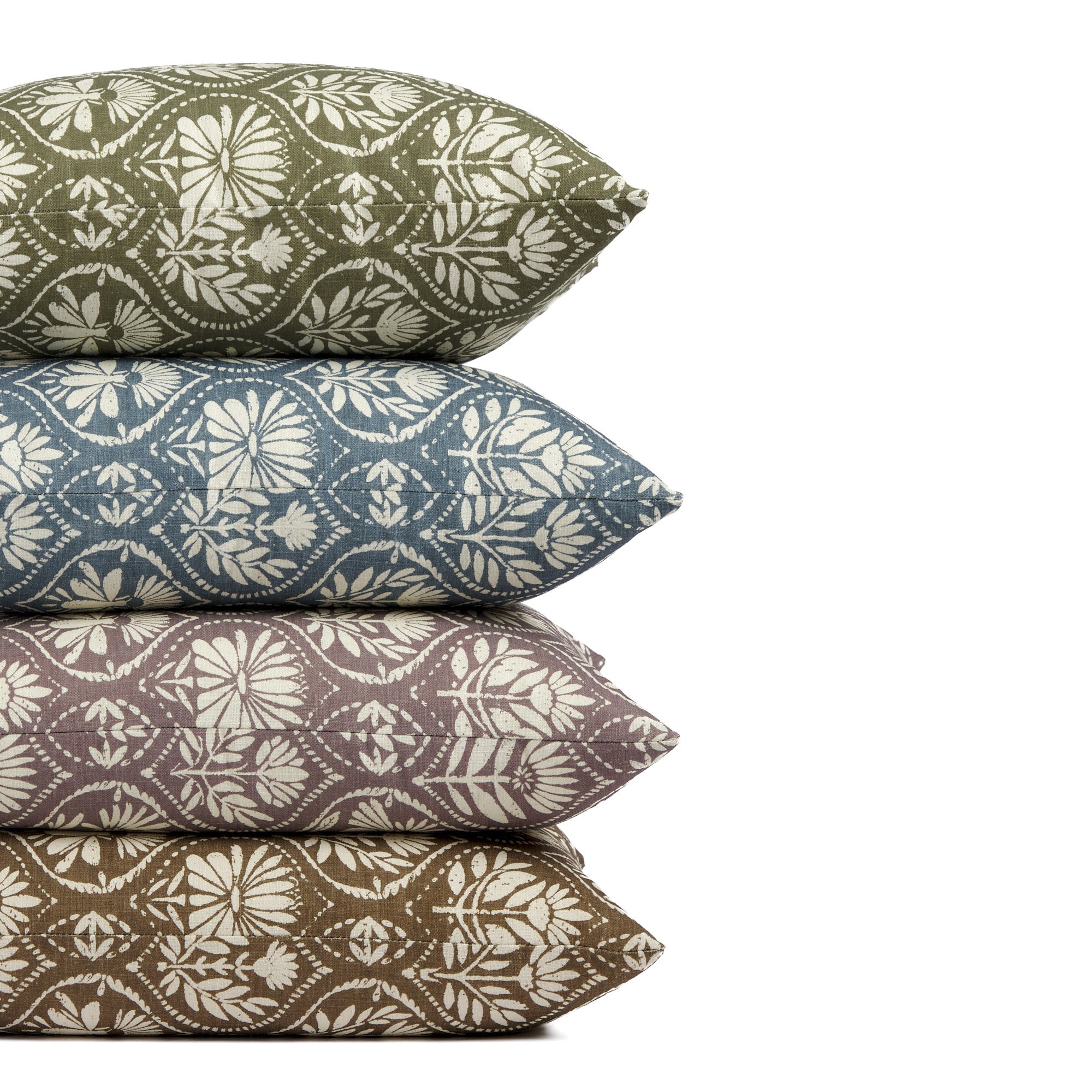 Stack of Tonic Living Stella 20x20 pillows in Evergreen, Harbour Blue, Mauve, and Mocha featuring floral medallion patterns.