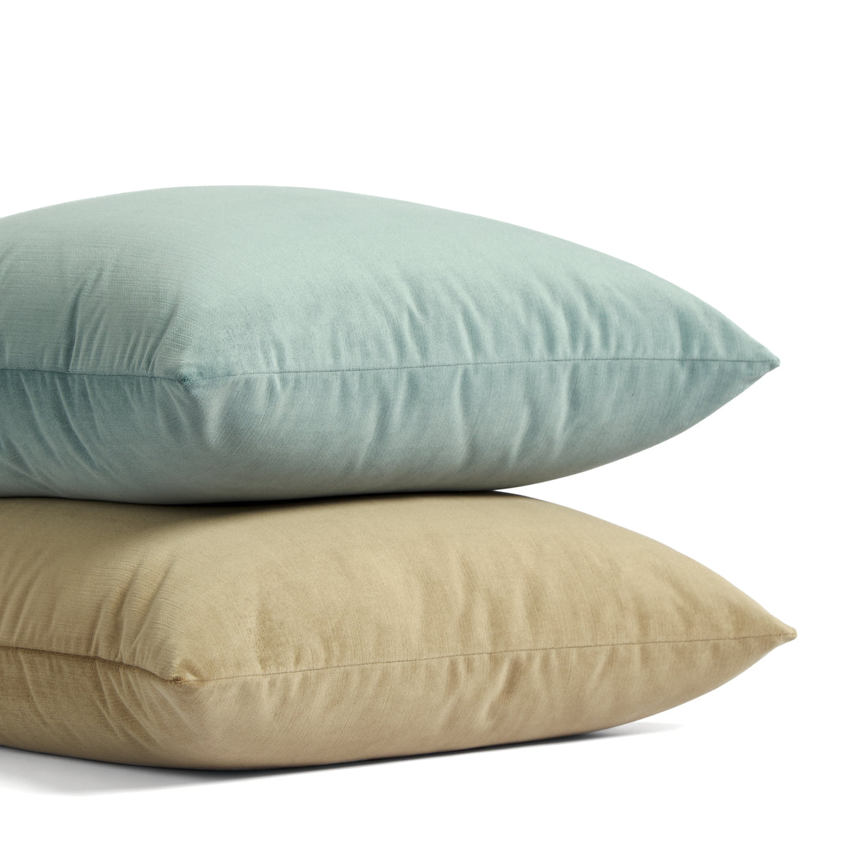 Stack of Tonic Living Sterling Velvet pillows in Lake aqua blue and Bark warm brown velvet.