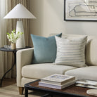 Tonic Living Sterling Velvet Lake decorative cushion styled on a sofa with a coordinating blue striped throw pillow.
