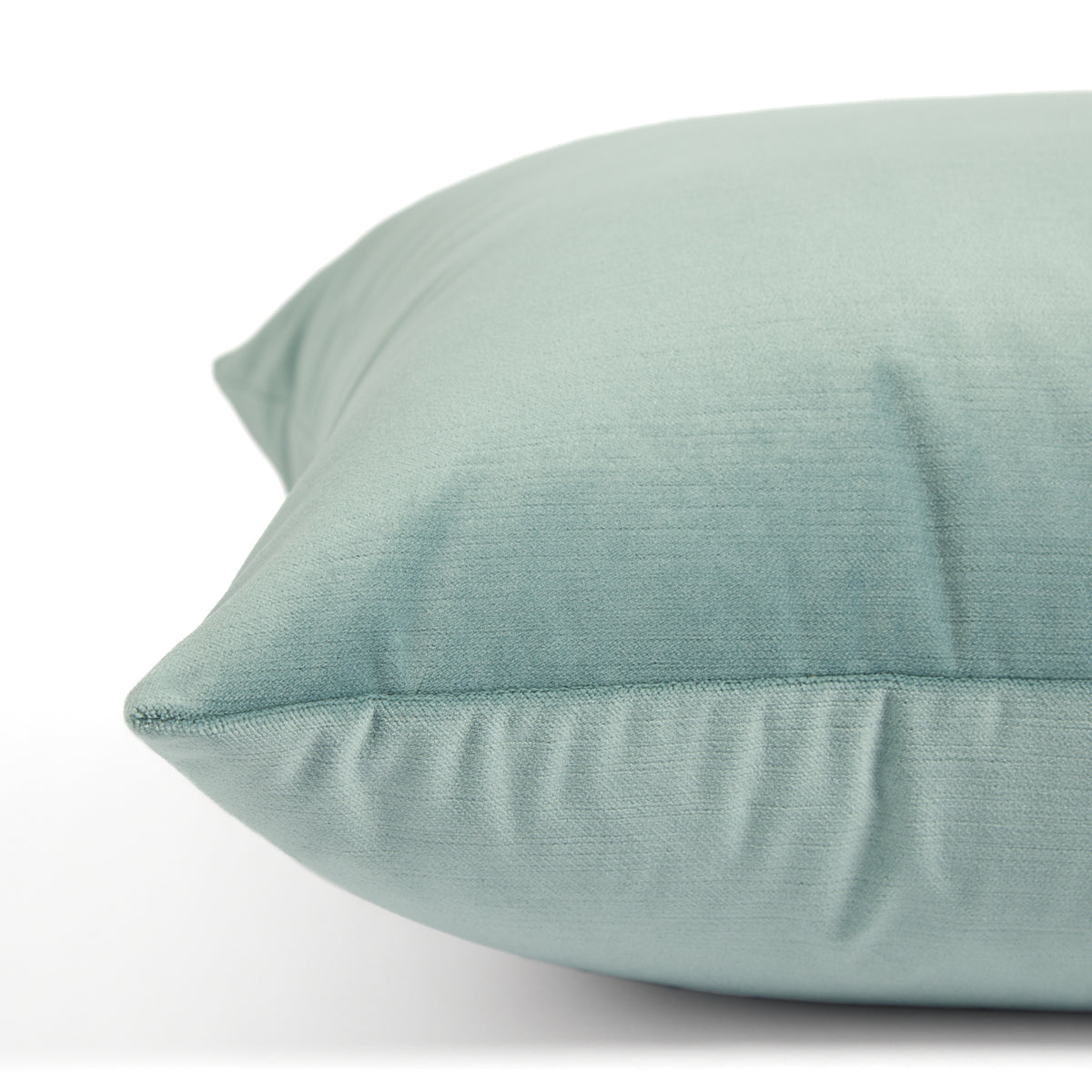 Side view of Tonic Living Sterling Velvet Lake toss cushion highlighting its watery blue velvet texture and soft sheen.