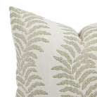 Close up of Tonic Living Swoon outdoor pillow showing sage green and white botanical stripe detail.