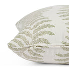 Side zipper detail of Tonic Living Swoon 20x20 outdoor toss pillow in sage green and white stripe.