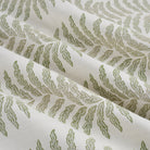Tonic Living Swoon Sunbrella Sage performance fabric showing soft drape and movement in a sage green botanical stripe.