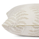 Side zipper detail of Tonic Living Swoon 20x20 outdoor toss pillow in beige and white stripe.