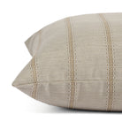Side view of Tonic Living Talisman Sand decorative cushion highlighting its textured stripe design.