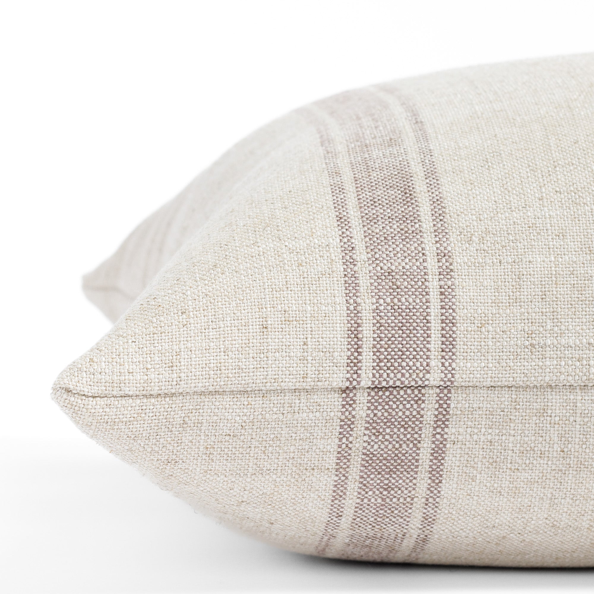 a soft purple and oatmeal striped throw pillow : close up side view