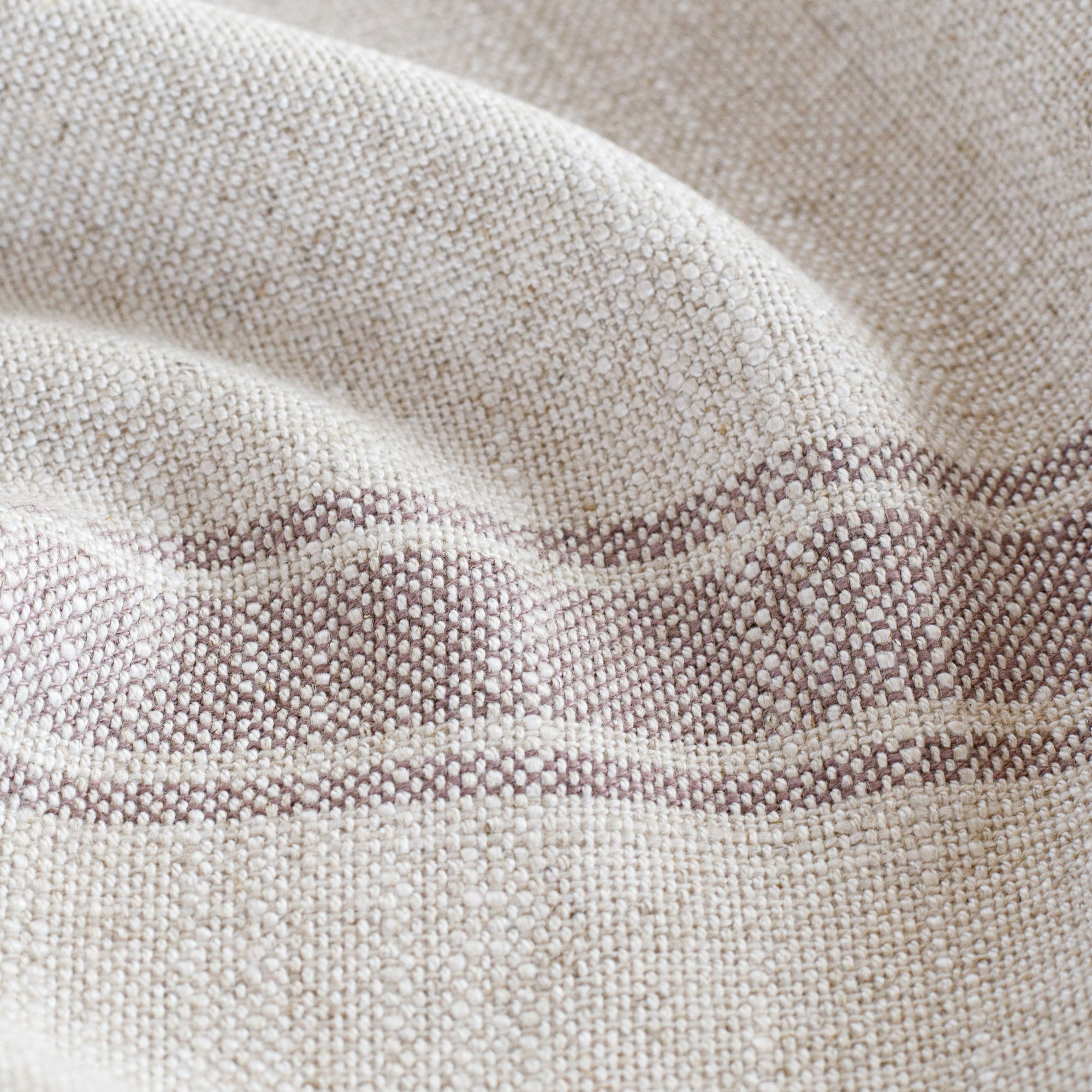 an oatmeal and soft purple stripe fabric : close up view