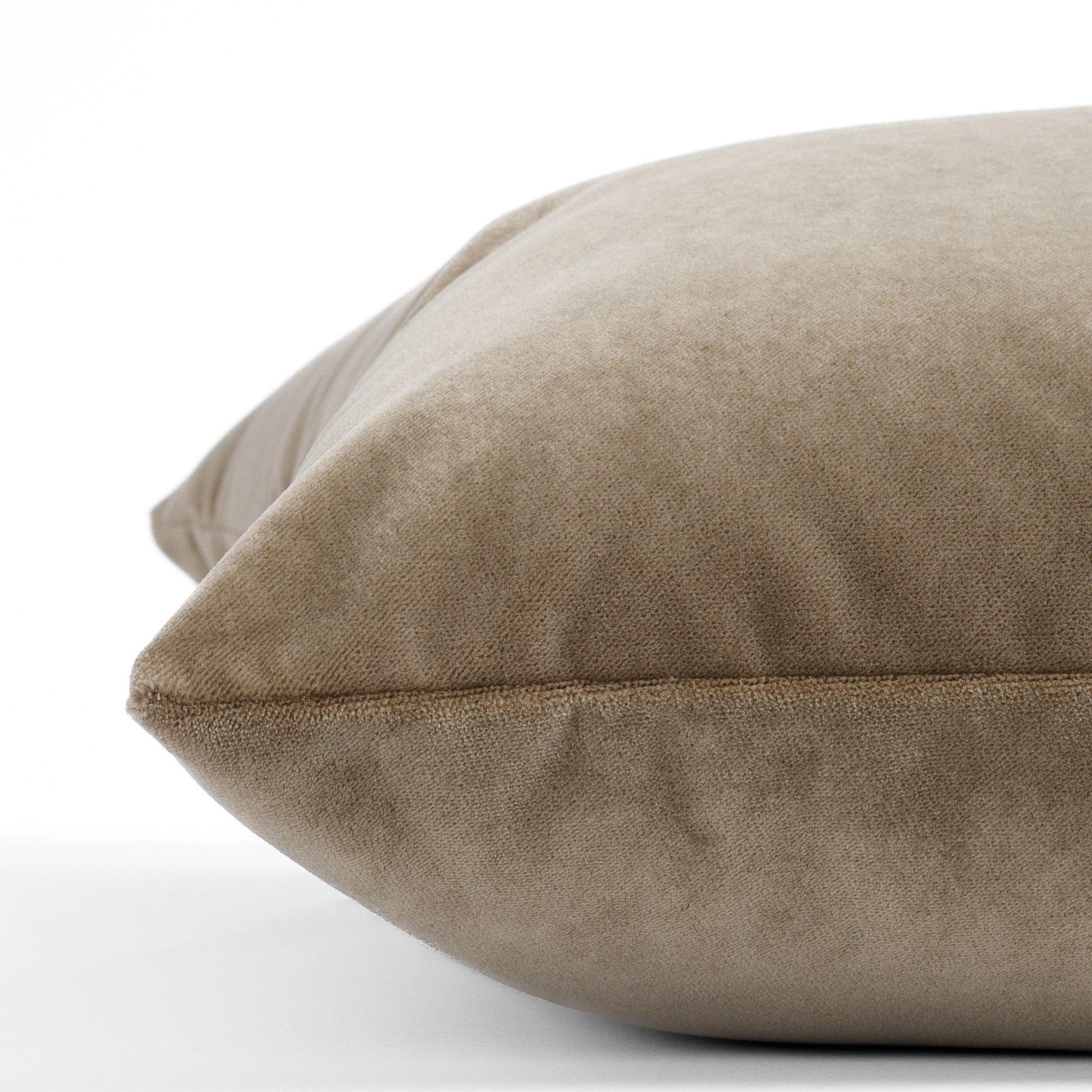 an earthy brown pillow : close up side view