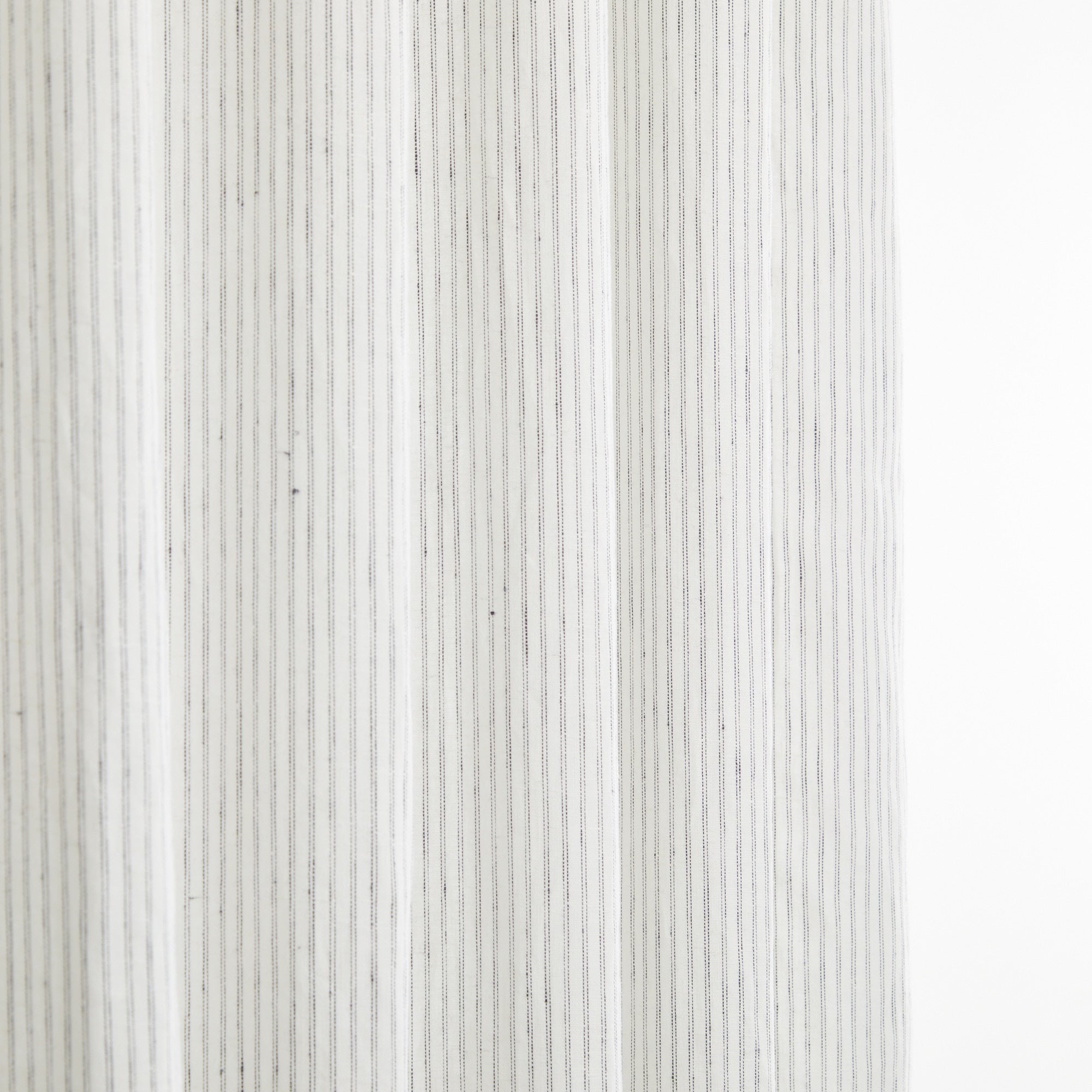 Tonic Living Verona Stripe Linen Shower Curtain in Jet showing vertical black pinstripe on soft white linen.