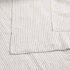 Close up of Tonic Living Verona Stripe Linen Shower Curtain showing tailored 4 inch bottom hem in black and white stripe.
