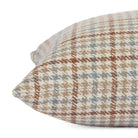 Side view close up of Vesper Plaid 14x20 plaid lumbar pillow in beige, blue, and brown.