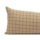 Close up of Tonic Living Walker Plaid Camel bolster pillow showing brown and navy windowpane lines with a fine herringbone weave.