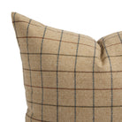 Close up of Tonic Living Walker Plaid Camel pillow showing brown and navy windowpane lines with a fine herringbone weave.