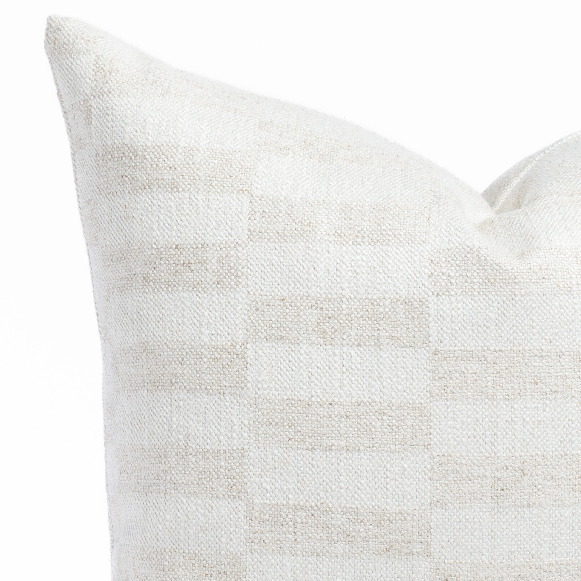a greige and cream checkerboard patterned throw pillow : corner detail