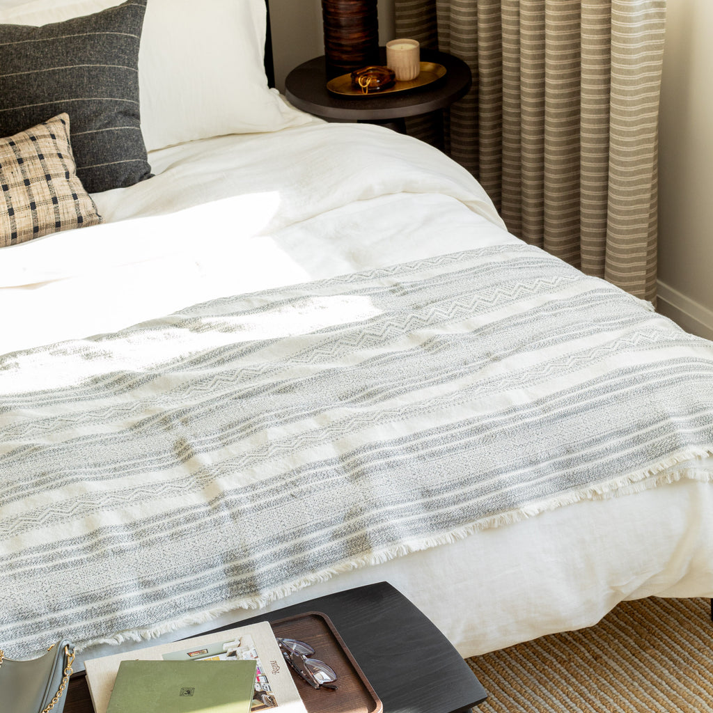 a cream and black wabi sabi striped bed throw blanket 