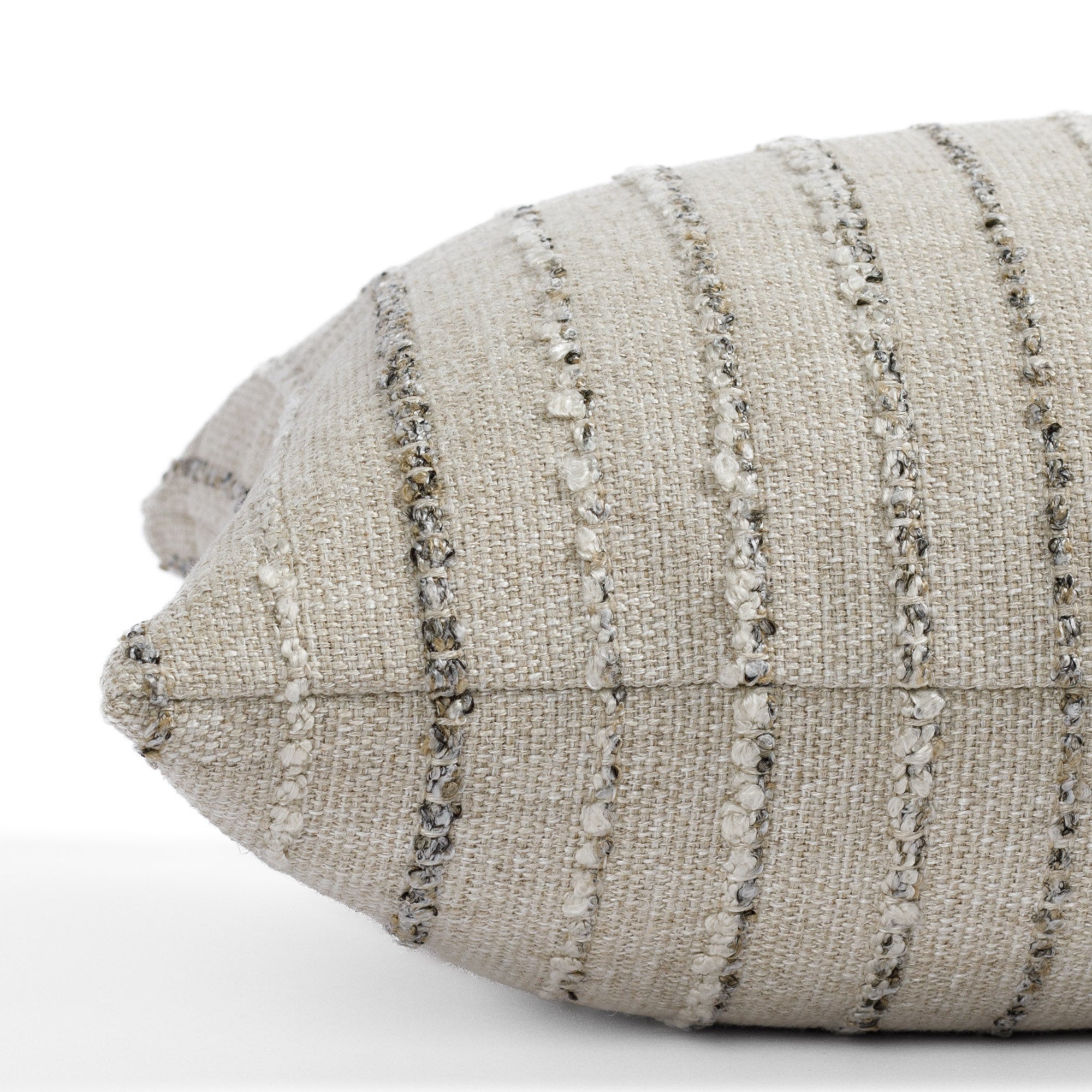 a neutral earth toned striped extra long lumbar pillow : close up side view