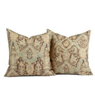 Two Tonic Living Zuri Driftwood throw pillows featuring a softly faded ornamental medallion design.