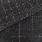 Dundee Fabric, Sable, a cream grid on dark gray ground fabric from Tonic Living