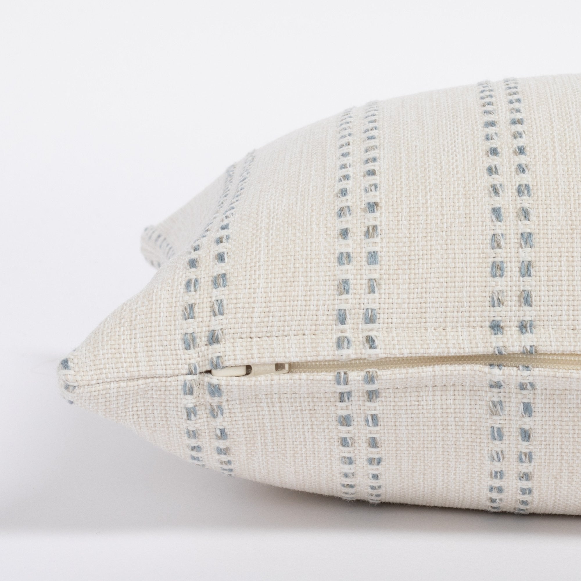 Elodie Sky 12x24 Lumbar Pillow, a cream and sky blue vertical stripe lumbar pillow : close up zipper side view