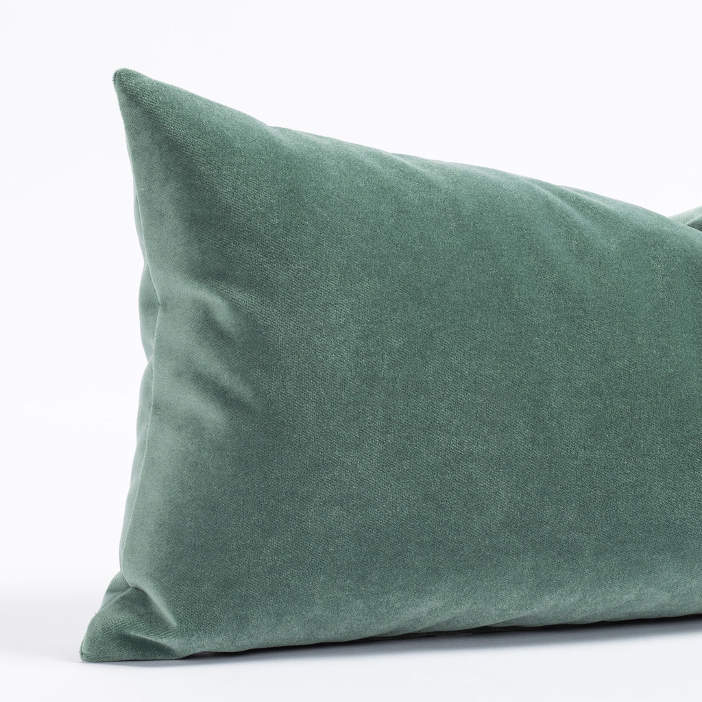 A jade green velvet lumbar throw pillow from Tonic Living