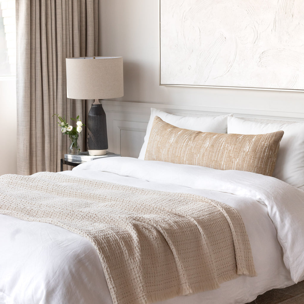 Neutral bed vignette : Alder Sisal bolster bed pillow with Lena natural throw blanket