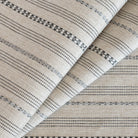 Anya stripe oatmeal cream and gray striped performance upholstery fabric from Tonic Living