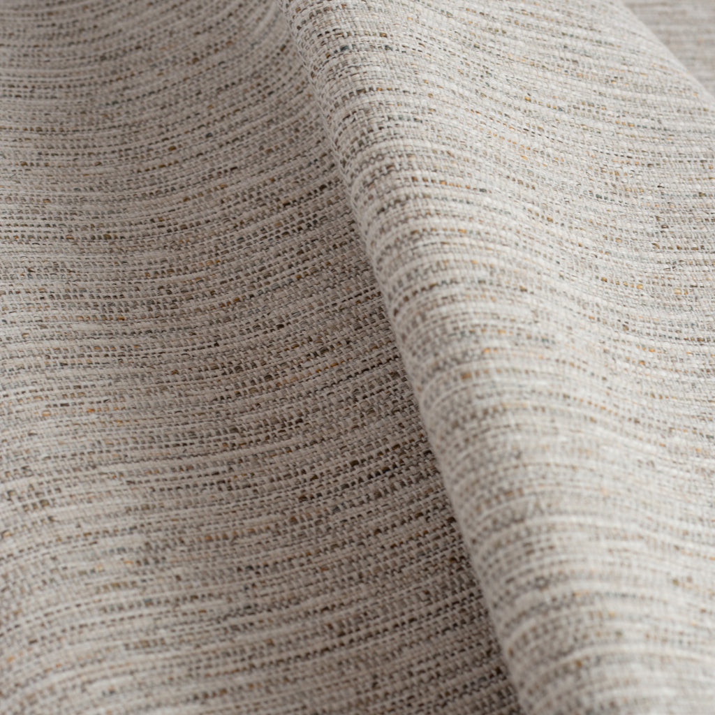  a textured warm grey upholstery fabric 