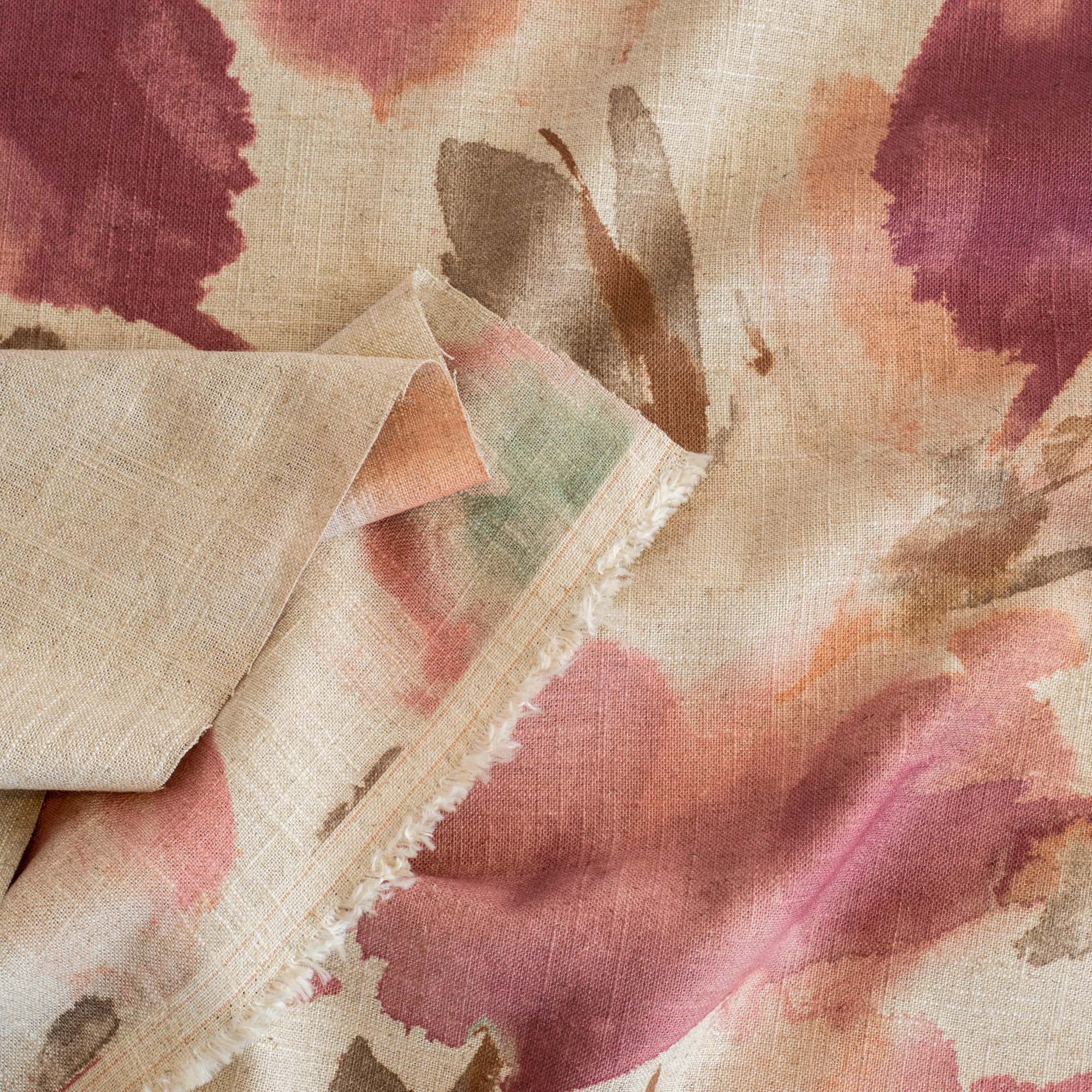 a painterly abstract floral print fabric in raspberry, coral, aqua and brown 