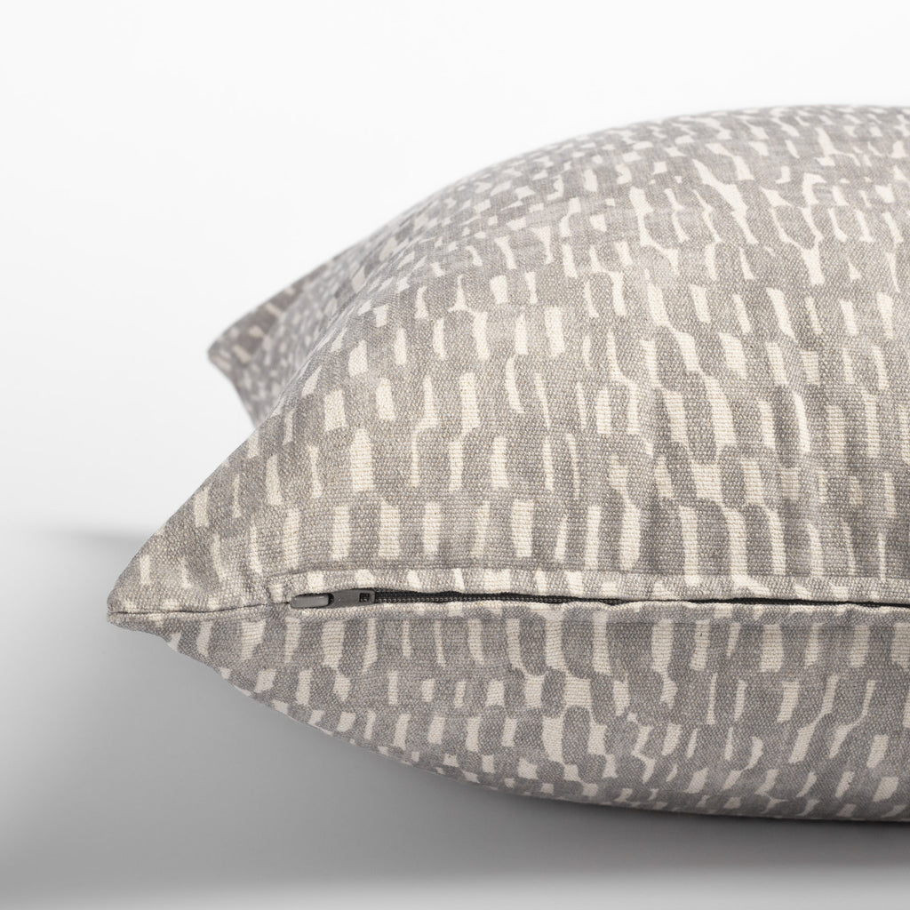 Avareno 20x20 pillow silver, a light grey and sandy beige small scale abstract print pillow : close up zipper detail
