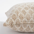 a creamy white and light brown nubbly wheat sheaf patterned decorative pillow : zipper detail