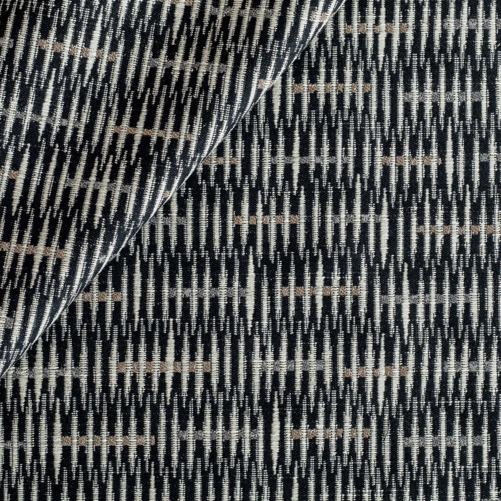 a graphic black, brown and tan upholstery fabric