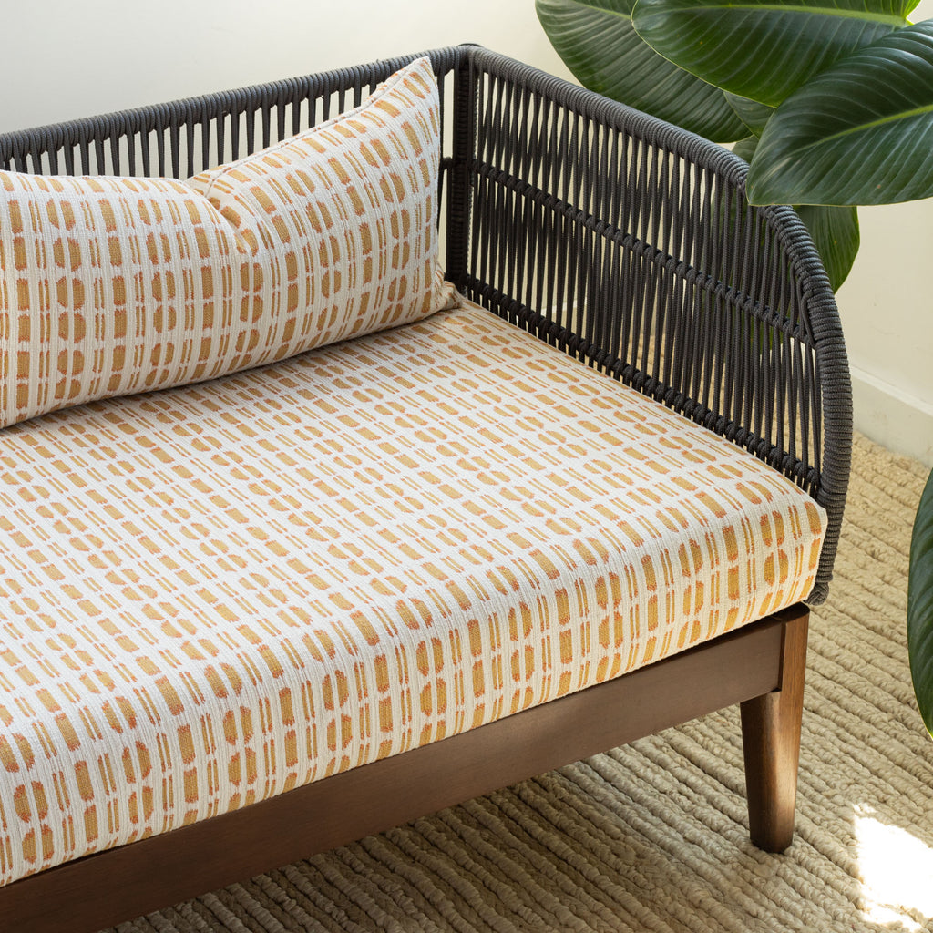 Calima Sunglow yellow and white ikat pattern indoor outdoor fabric bench cushion and pillow