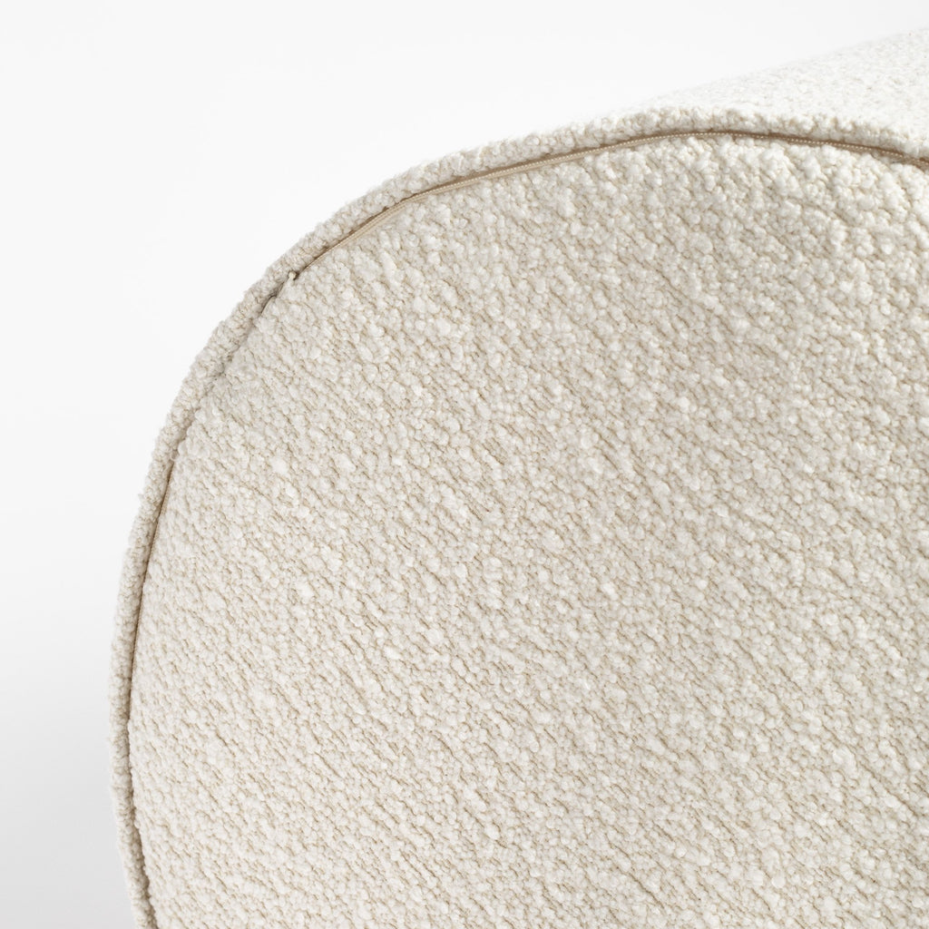 Cambie Boucle Chalk Ottoman, a creamy, off-white boucle fabric round ottoman : close up bottom