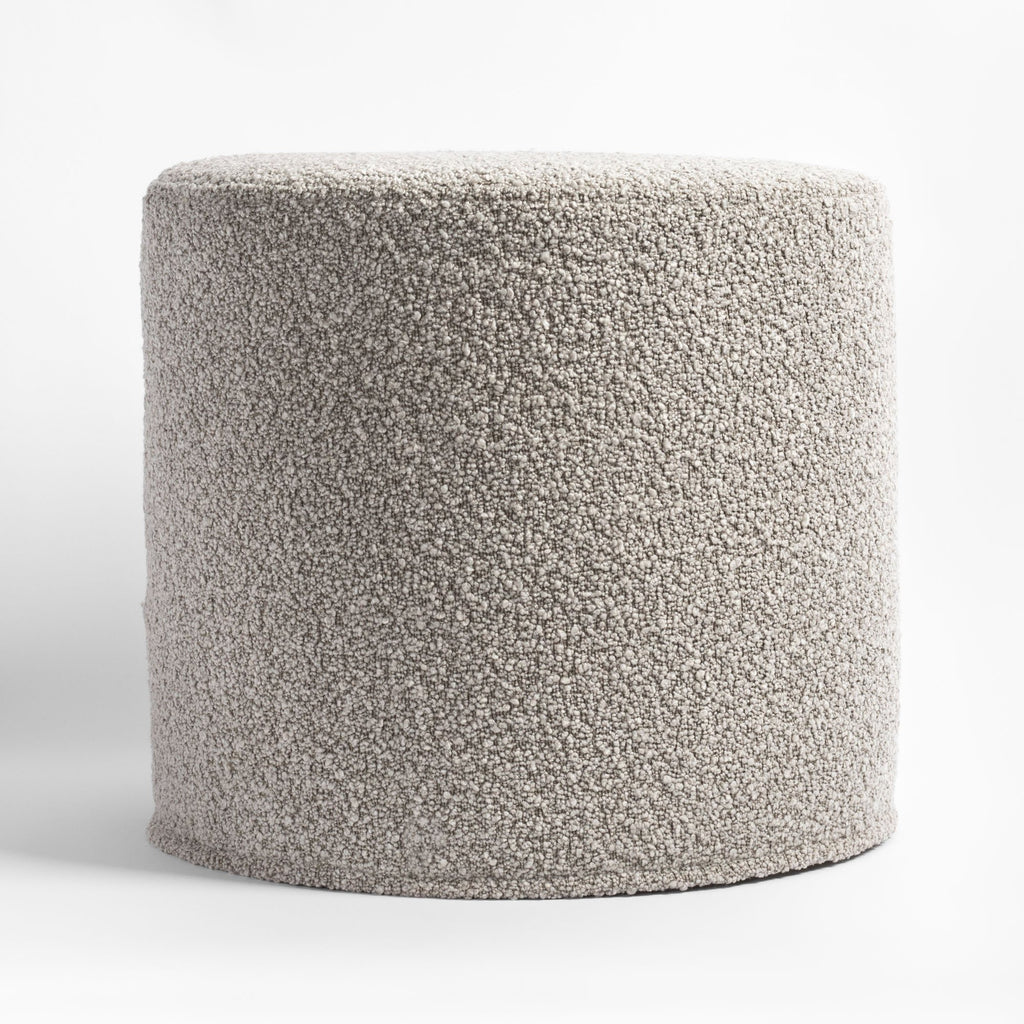 Cambie Boucle Silver Mink Ottoman, a warm grey boucle fabric round ottoman : side view