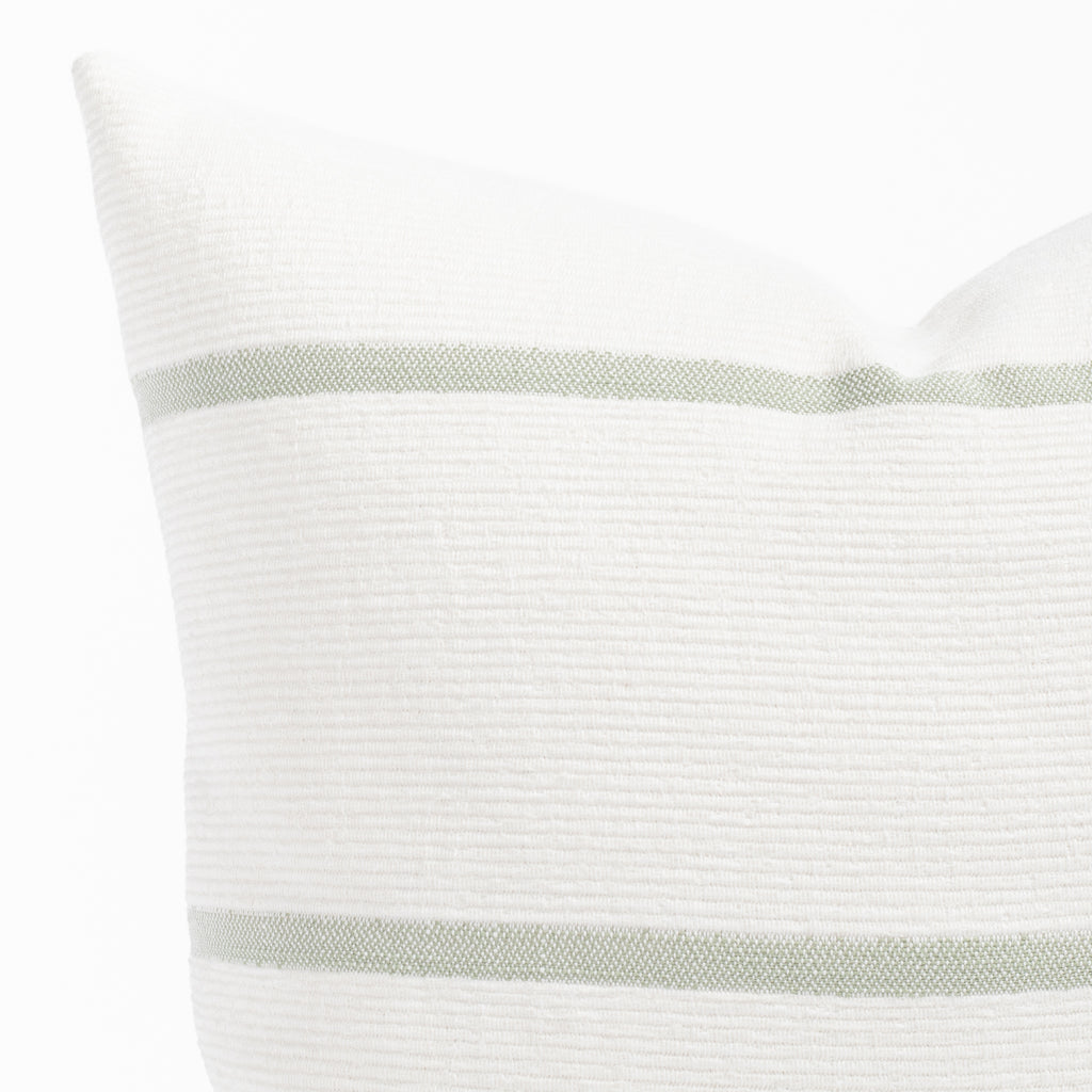 a white and green stripe throw pillow : close up view