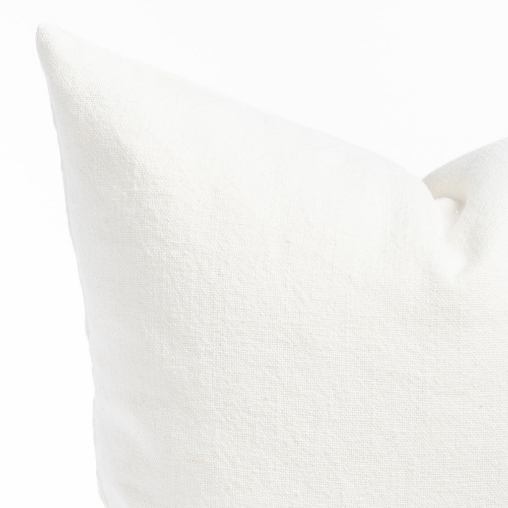 a cream white washed linen cotton pillow : close up photo