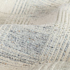 a light gray and denim blue plaid fabric : close up view