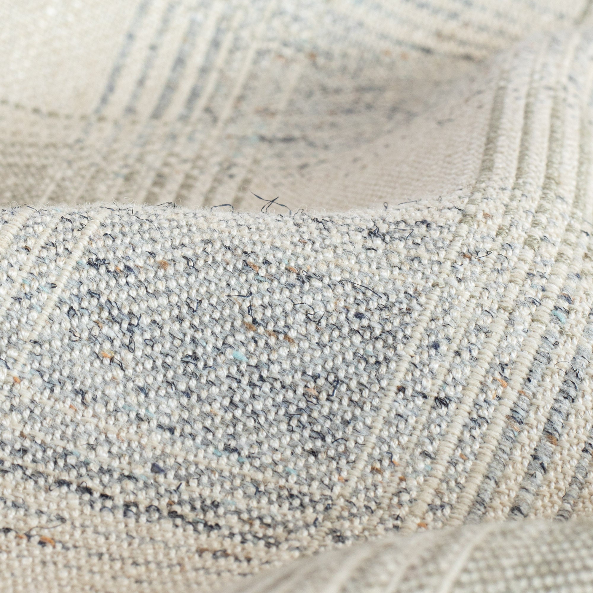 a light gray and denim blue plaid fabric : close up view