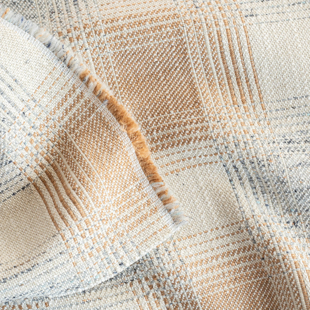 an oatmeal cream, terracotta orange and denim blue plaid upholstery fabric : close up view
