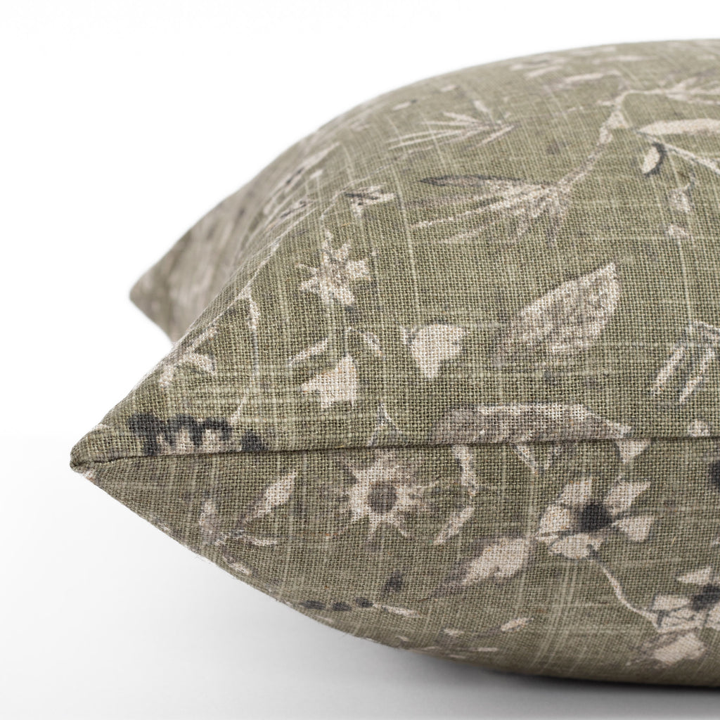 a mossy green vintage flora and fauna print throw pillows : close up side photo
